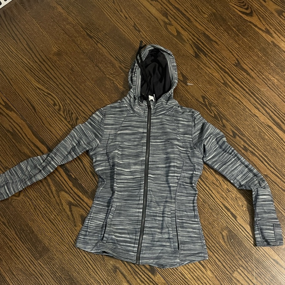 Lululemon Hooded Define Jacket in Nulu fabric with a heathered black/white color